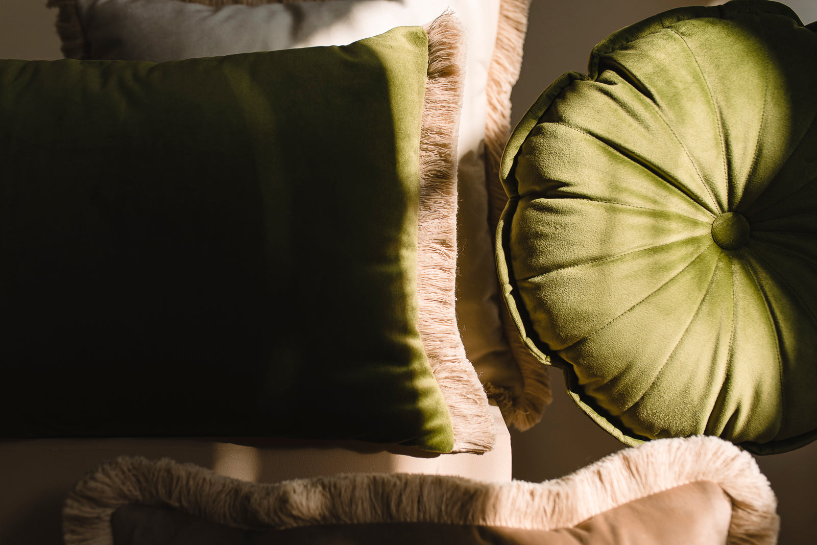 green, ecru and brown cushion velvet set in morning light  