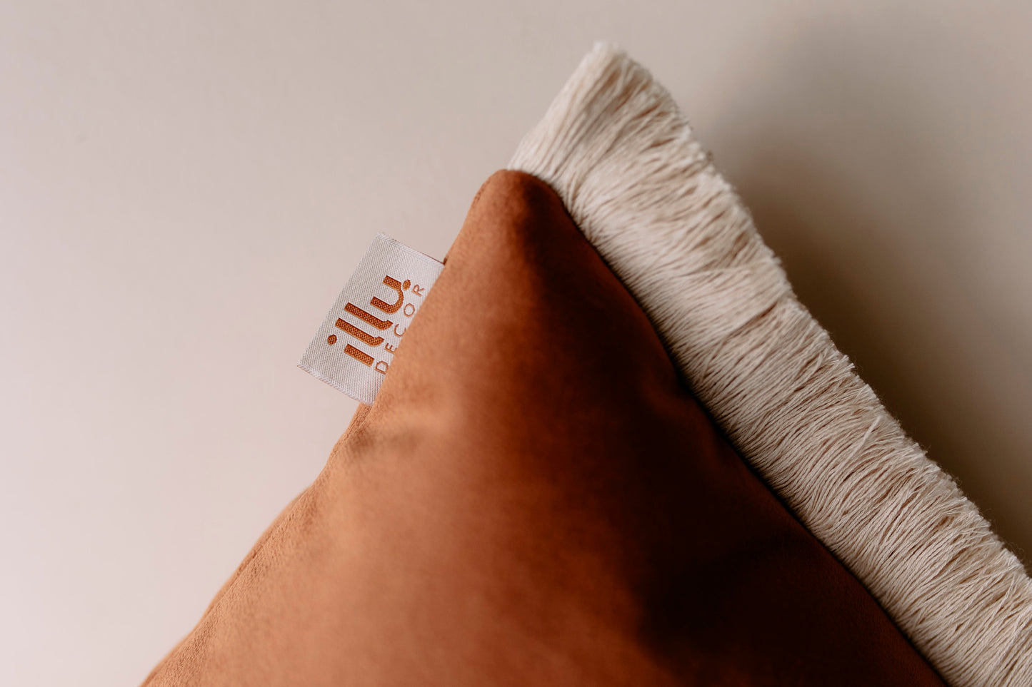 cotton fringe of a velvet pillow