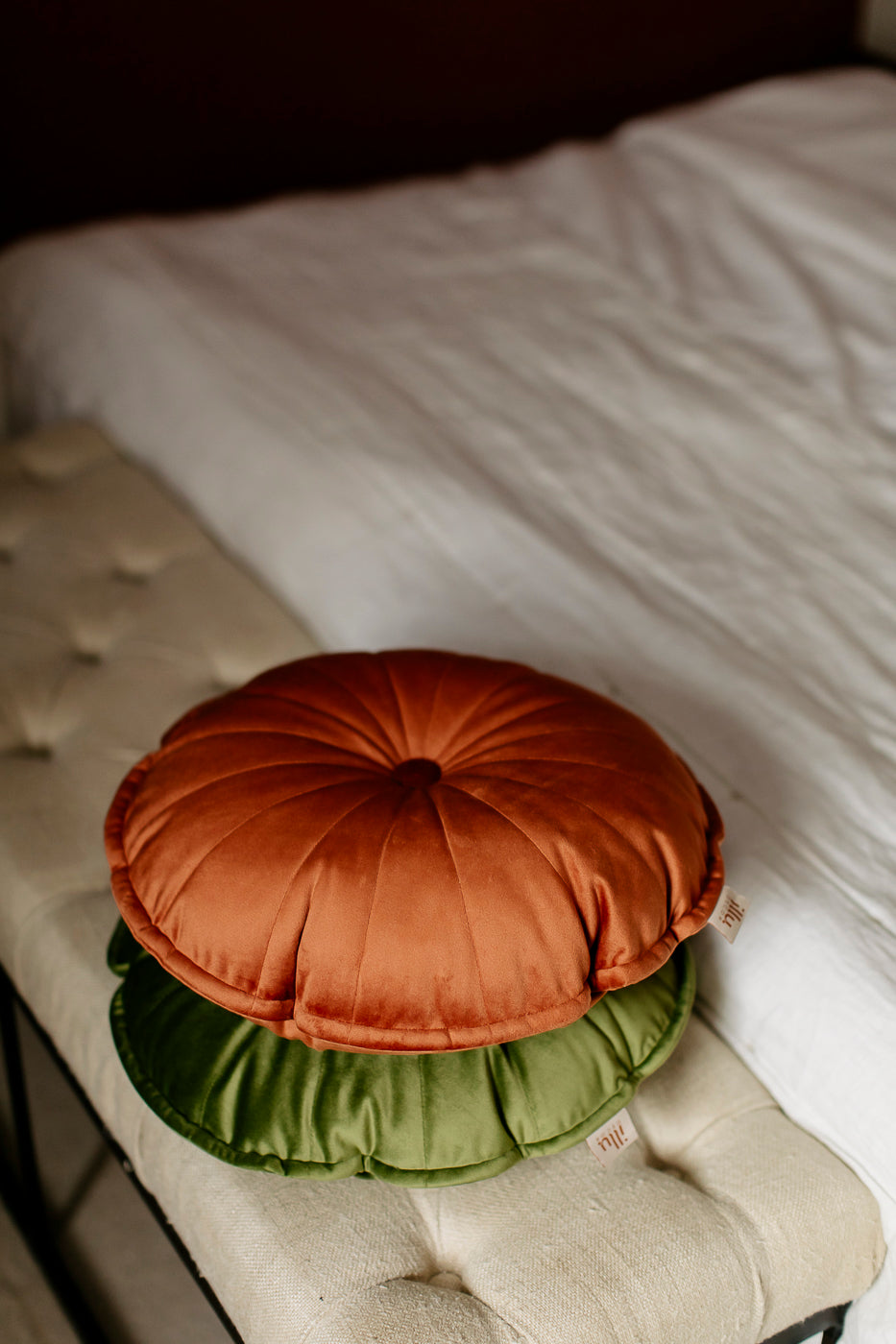 round orange and green pillows