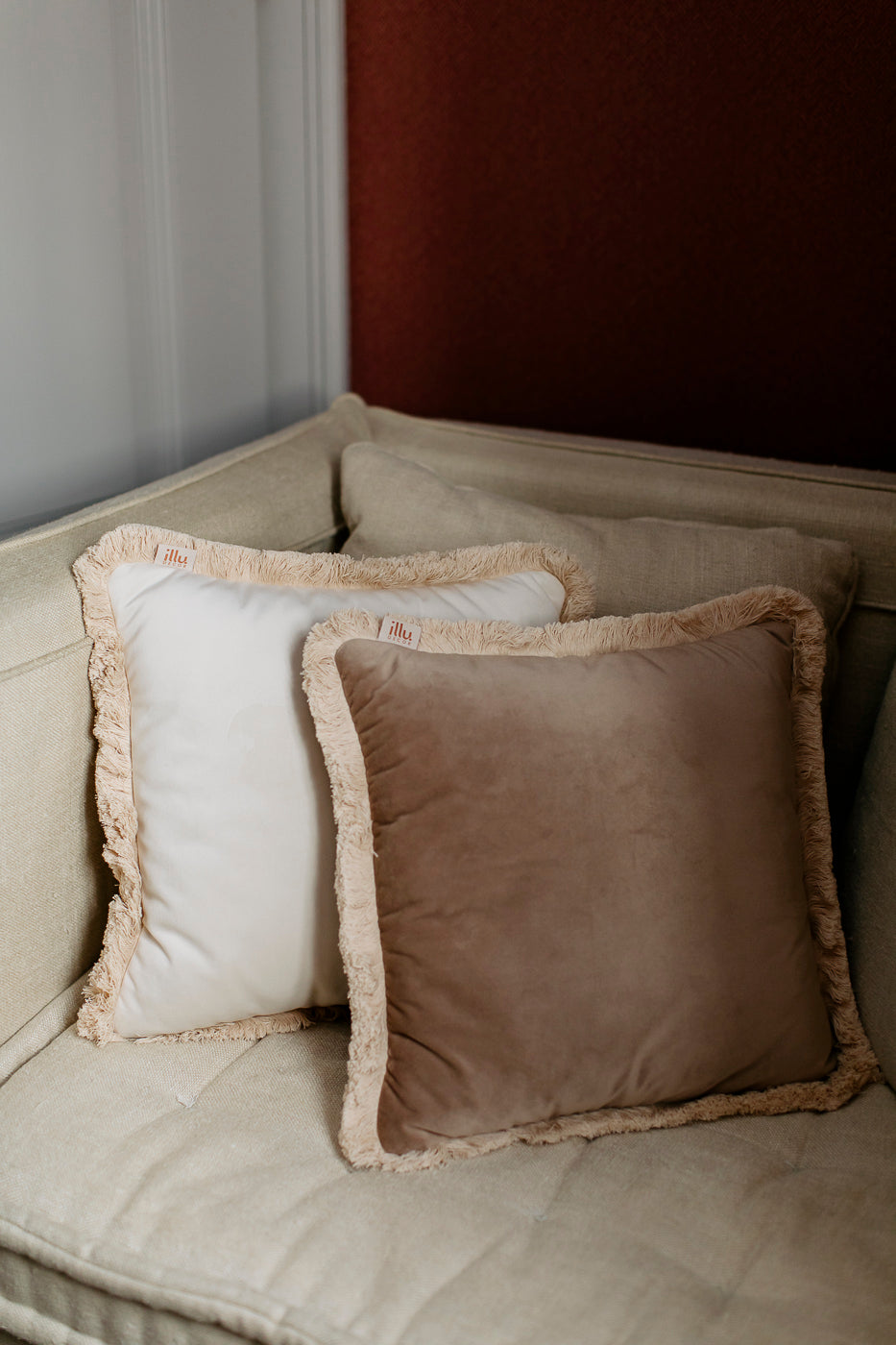 white and brown pillow on an armchair